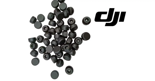 Assorted dark rubber weighing head caps and inserts, scattered