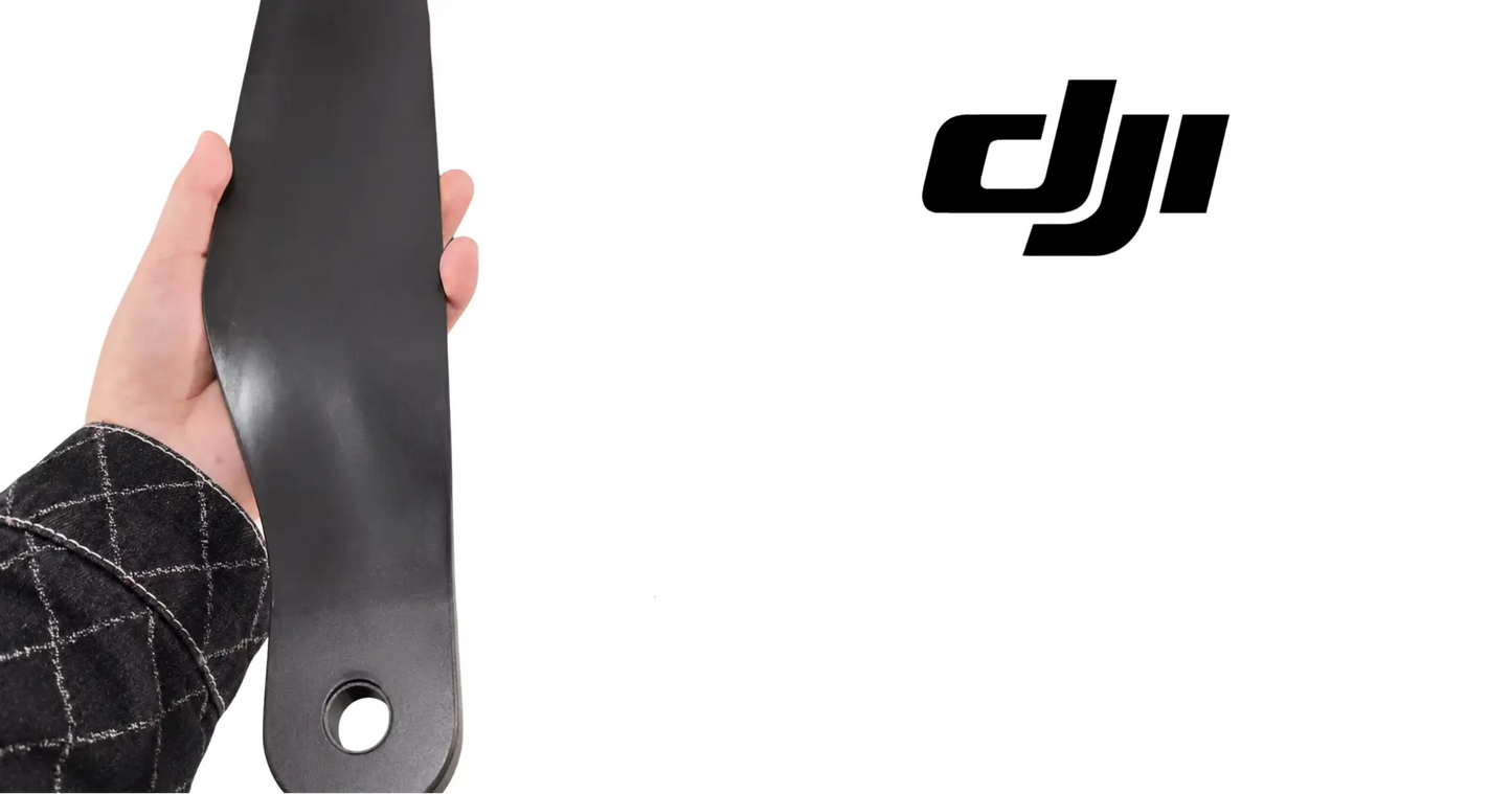 DJI T100 propeller blade close-up with mounting hole and orange tip