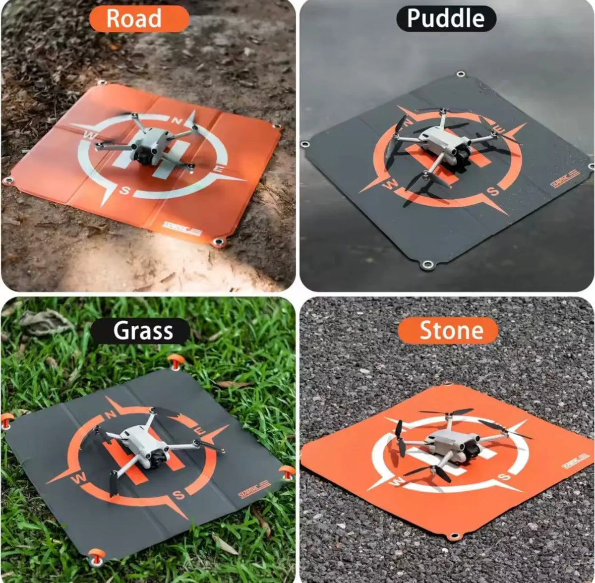 Orange and black drone landing pad on ground surfaces with drone shown