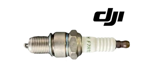 Spark plug with metal body and white insulator, side view, DJI