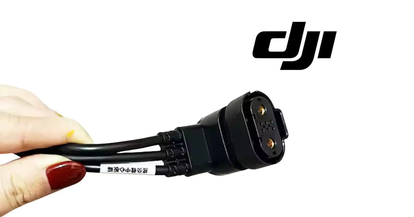 DJI load adapter cable plug end with small gold contacts, black
