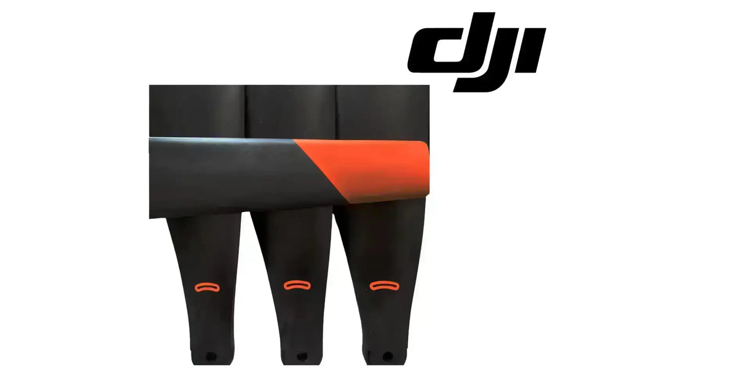 DJI carbon fiber propellers set, black blades with orange tip lines, front view
