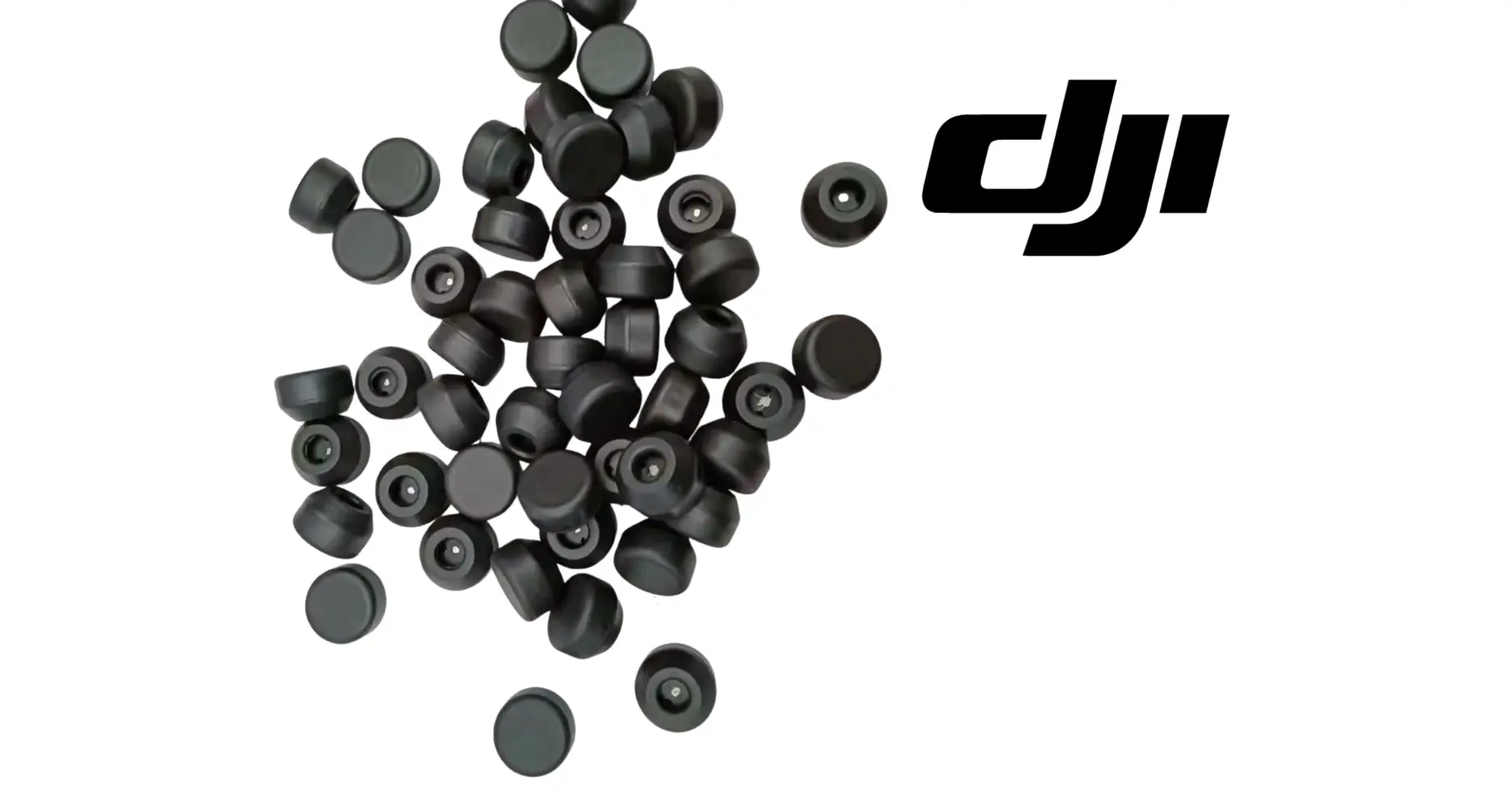 Assorted dark rubber weighing head caps and inserts, scattered
