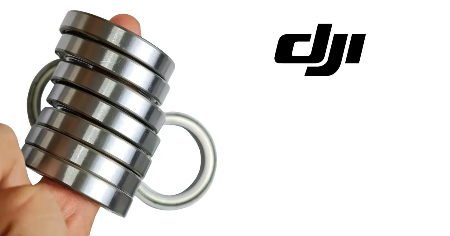 DJI motor bearing set showing stacked metal rings and a curved wire