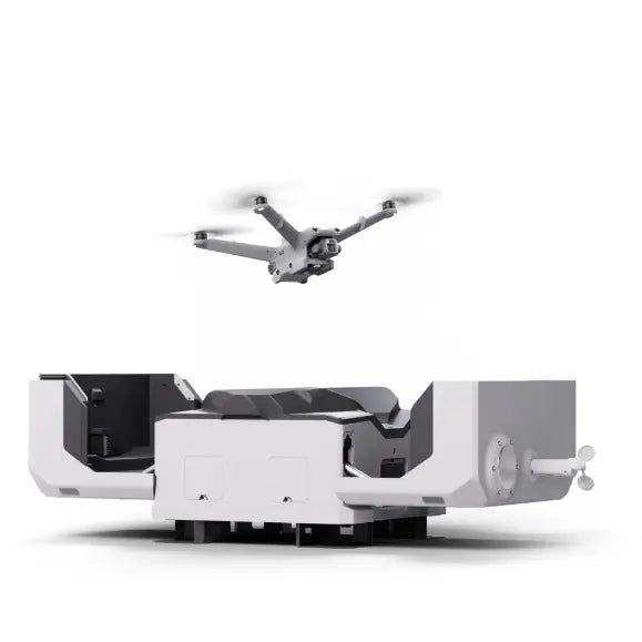 DJI Dock 2 docking station with drone hovering above, side view