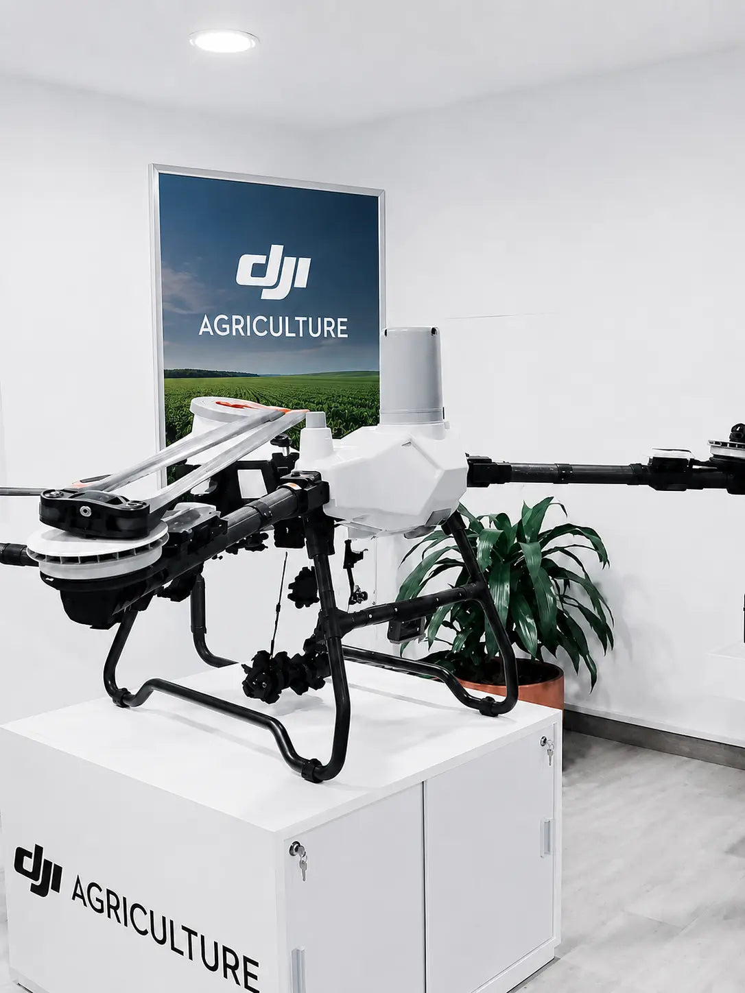 DJI Agras T55 agricultural sprayer drone display unit with DJI Agriculture branding