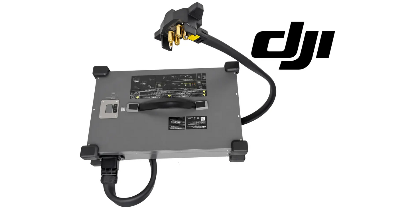 Gray power supply with front label panel and black cable connected to gold terminals.