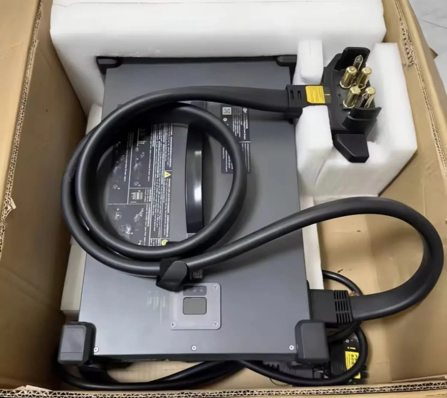 DJI battery charger power supply with thick cables, terminal clamps, and side ports.