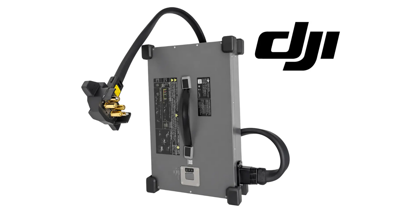 Gray DJI charger unit with side terminals, black cable leads, and gold battery clamps.