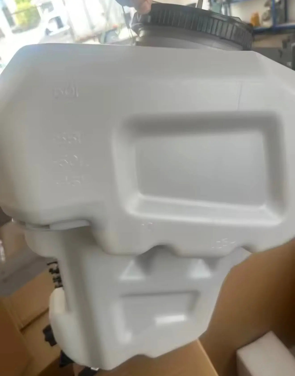 Light blue drone enclosure with front panel ports and side brackets, close-up