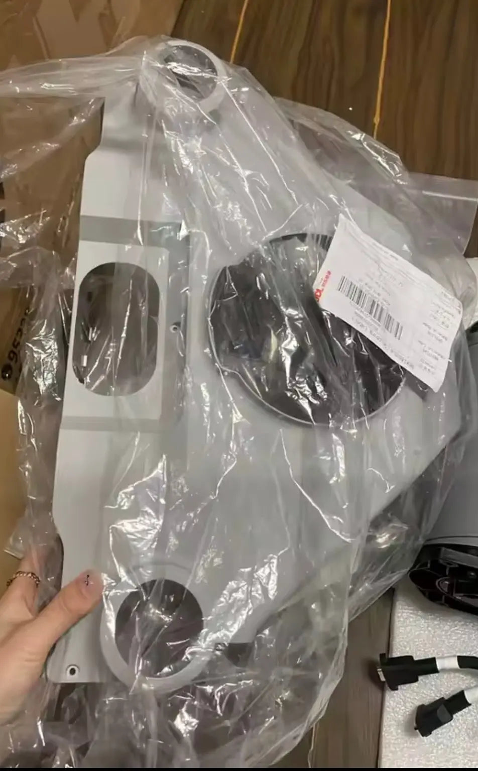 Gray front frame parts and wiring in sealed plastic bag