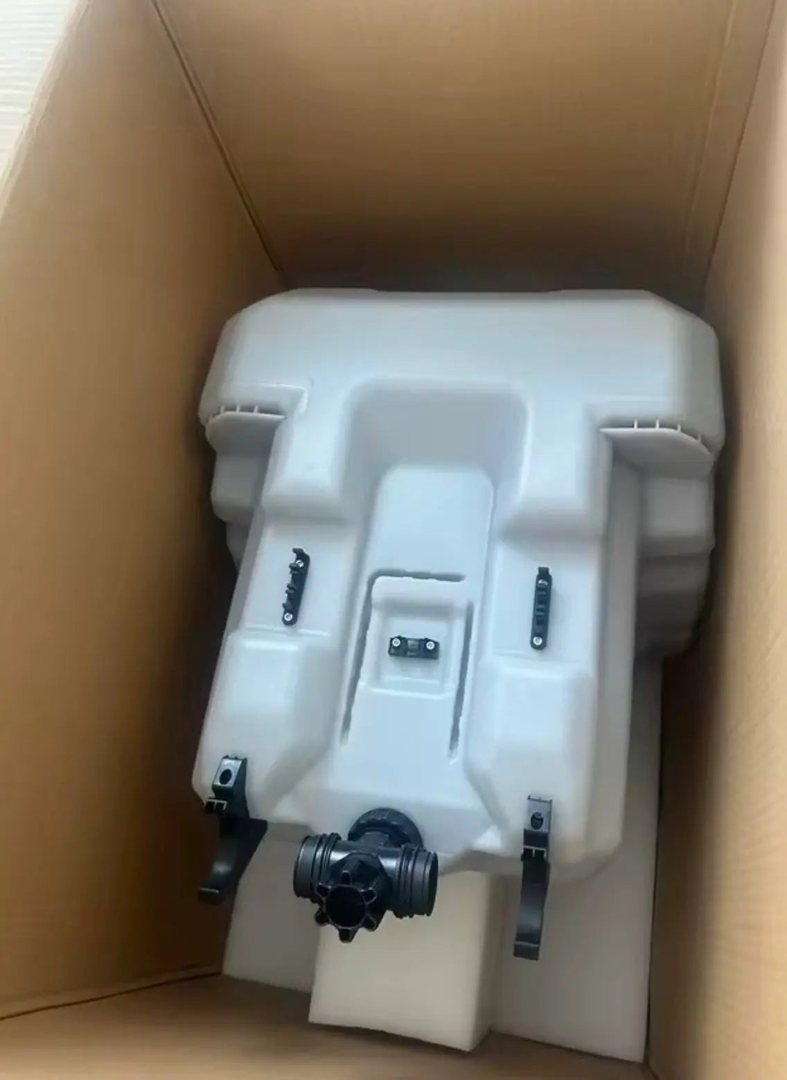 Drone enclosure in foam-lined box, front view with ports and brackets
