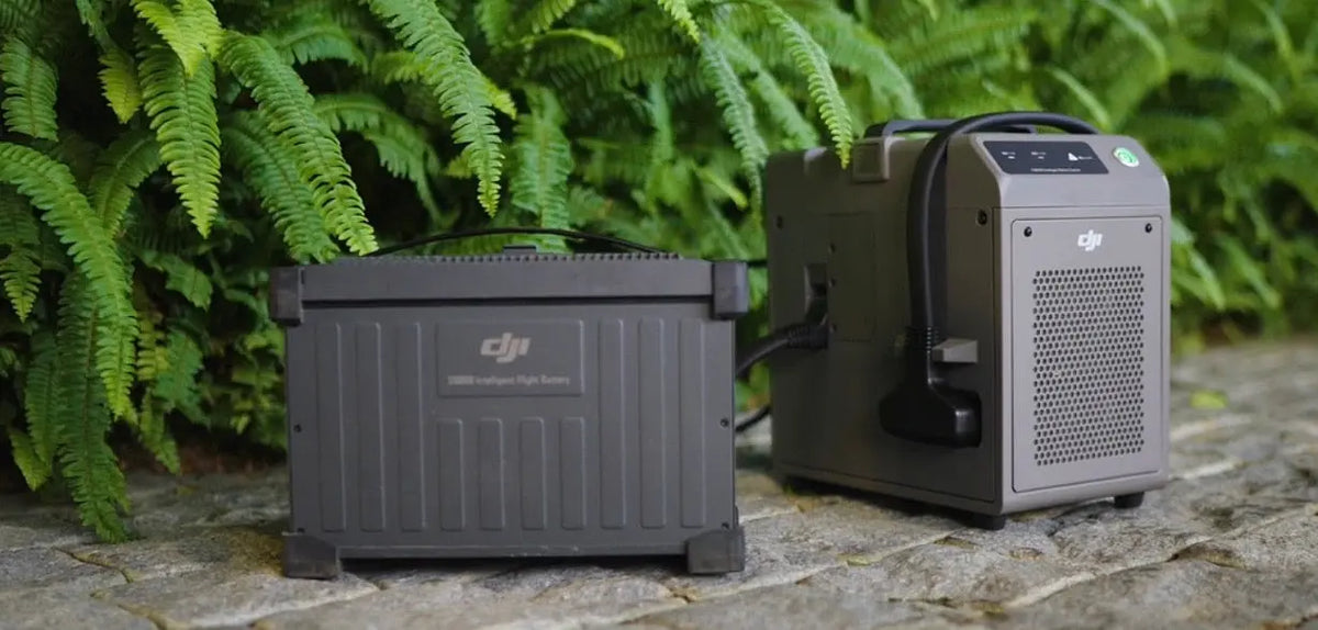 DJI equipment case with generator-style unit, dark gray, outdoor setup