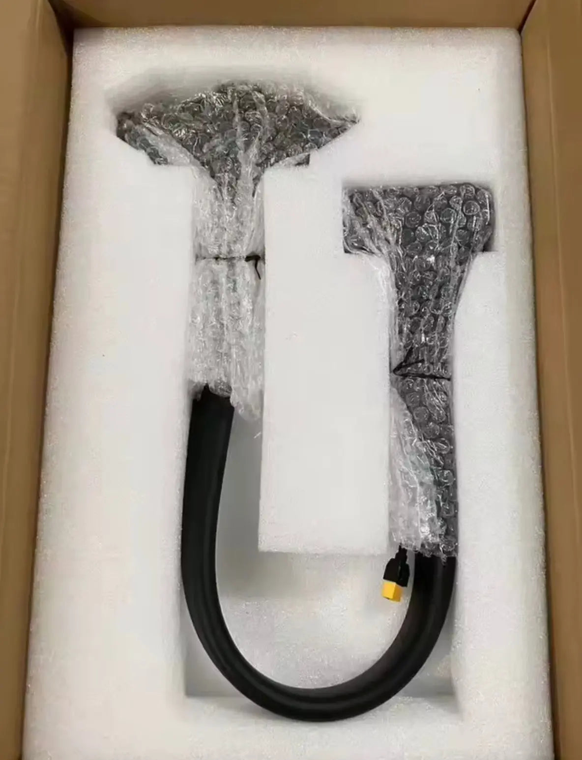 Battery charging adapter cable with black Y-split connectors and inline yellow port
