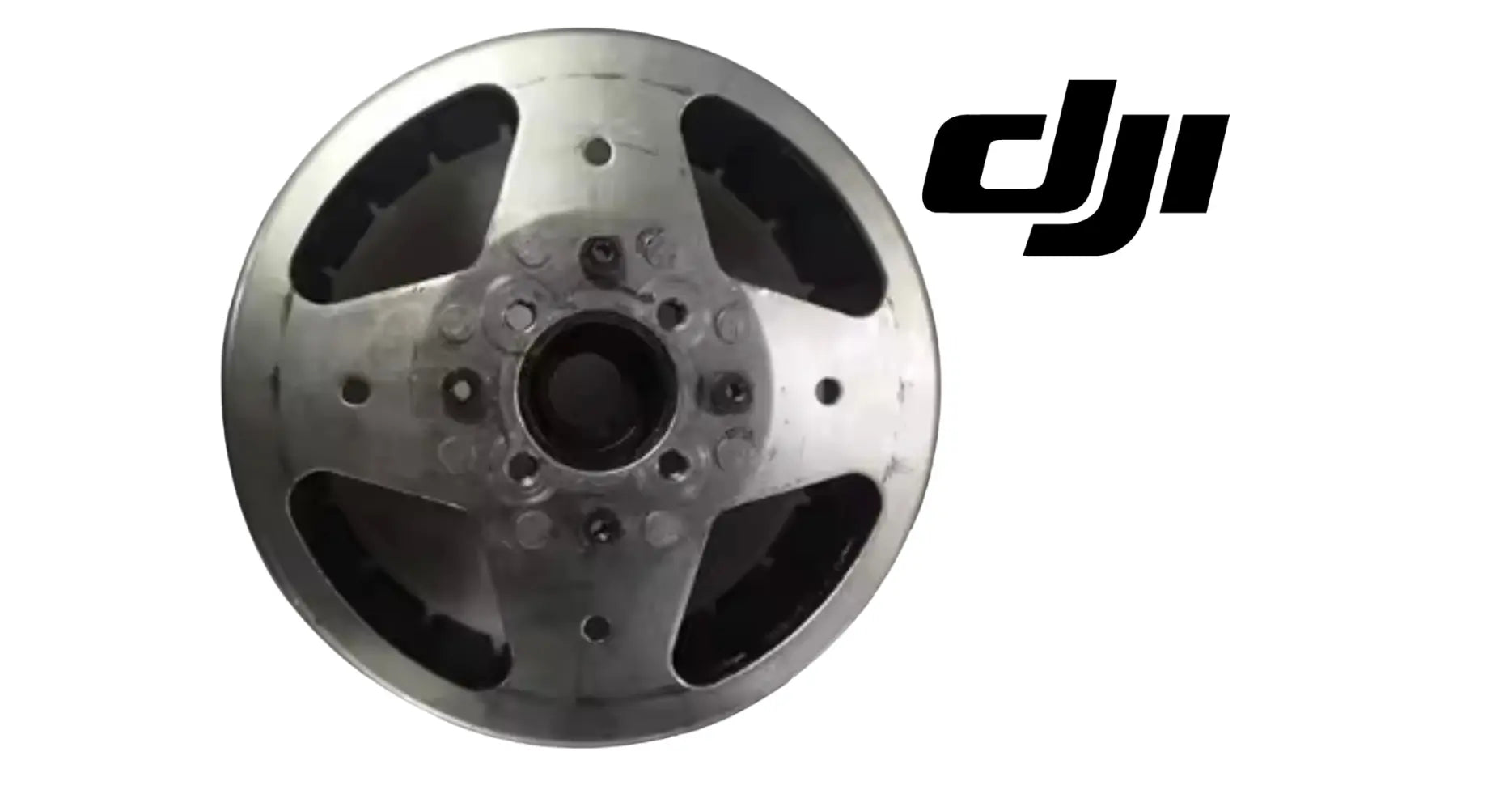 DJI magneto rotor with four black blades and central hub, metal alloy finish