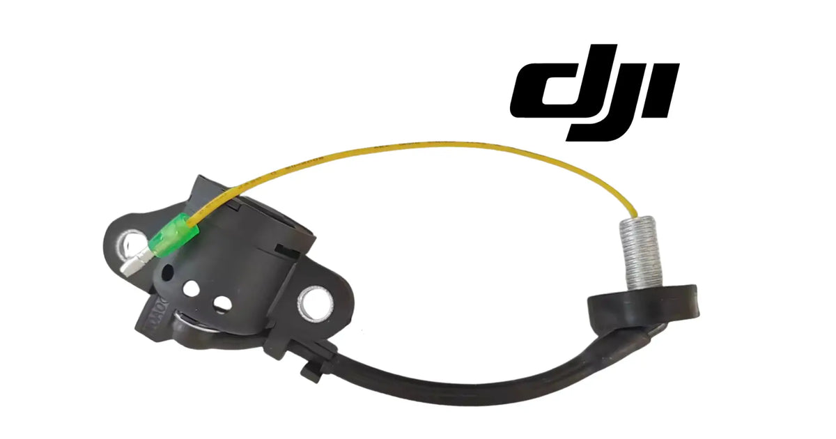 Oil sensor assembly with black housing, yellow wire loop, green tip, and silver threaded part