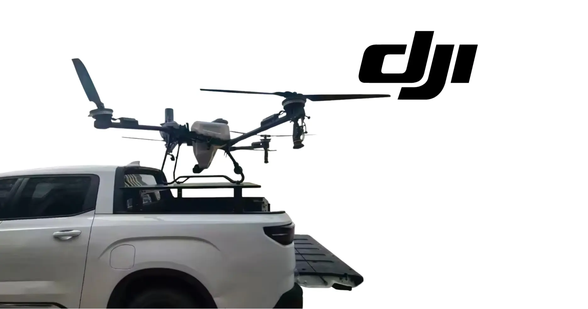 DJI truck UAV launch trailer side view with drone over cargo bed