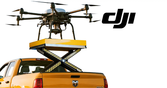 DJI drone above yellow scissor-lift platform on pickup truck bed