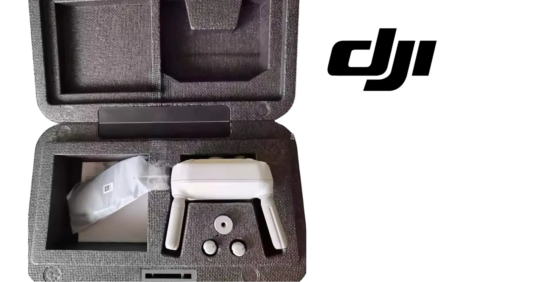 DJI signal repeater system foam case with white unit, manual, and accessories