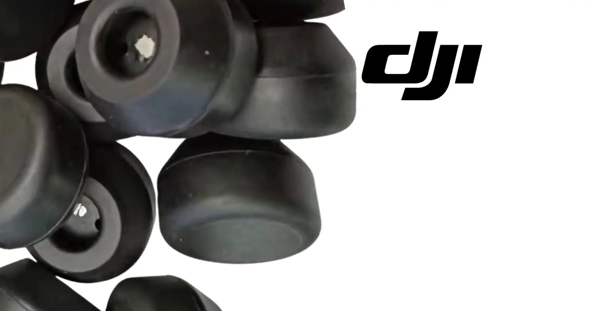 Black rubber sensor pads with DJI marking, close-up circular caps