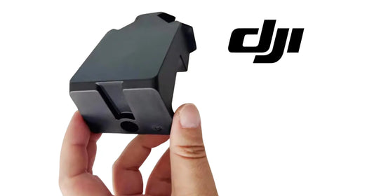 DJI Agras rear load bracket held in hand, black OEM part with mounting tabs.