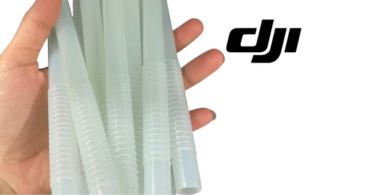 Hand holding translucent blue ribbed hoses with threaded ends for DJI T70