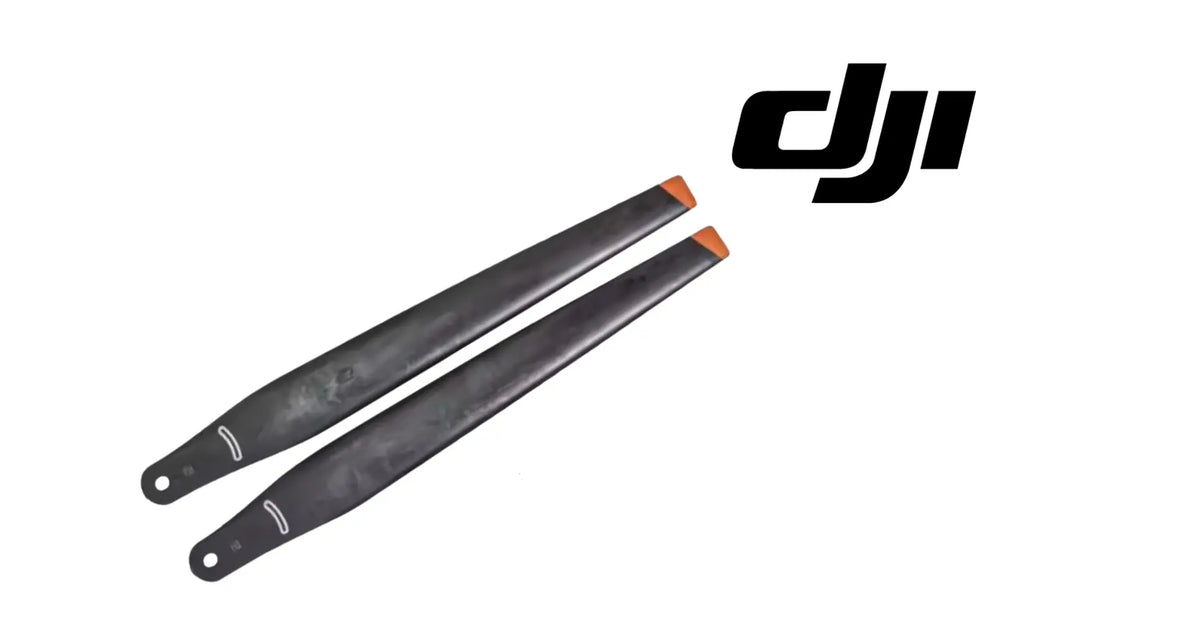 Two black drone propellers with orange tips, side-by-side blades with mounting holes