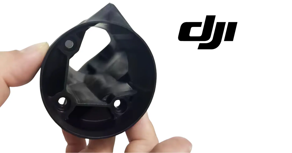 DJI T100 spray nozzle cover shell, black plastic with mounting screw holes