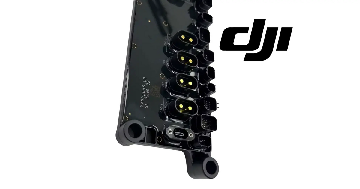 DJI Agras distribution board module PCB end view, black with contact terminal rows