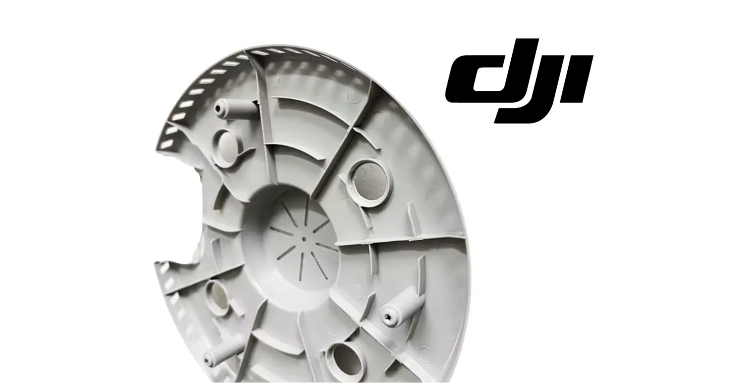 DJI Agras T100 motor lower cover, side view of gray circular housing with cutouts and holes