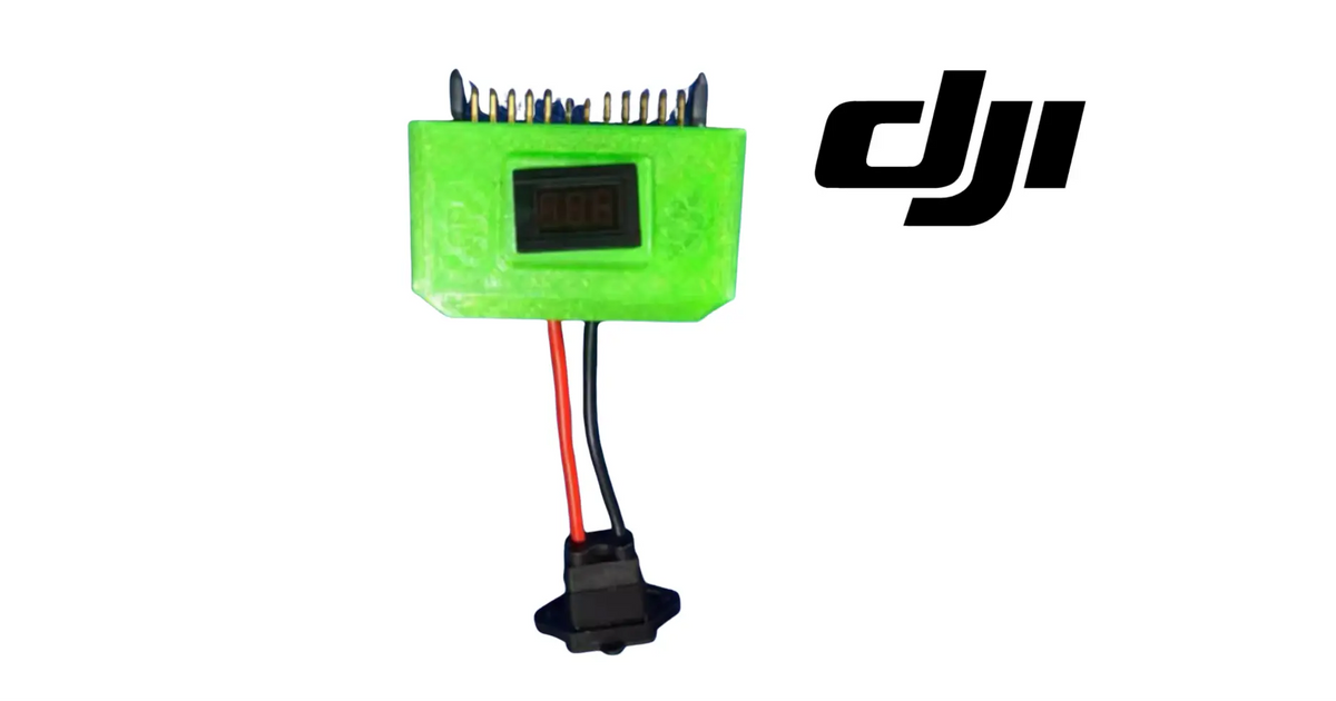 Green battery maintenance module with LCD screen and multi-pin contacts, red/black leads
