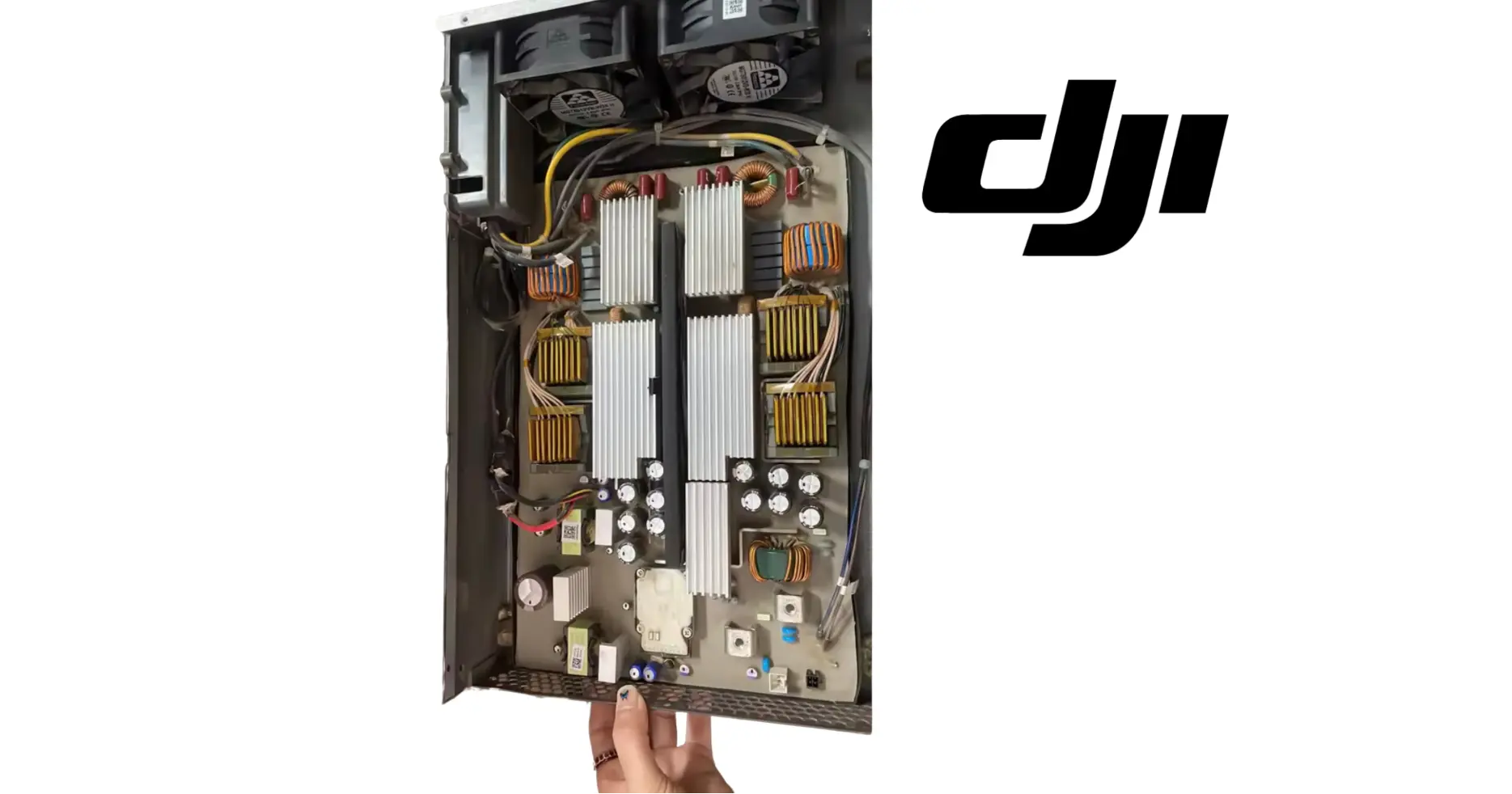 DJI Agras AC-DC power module interior view with heat sinks and connectors