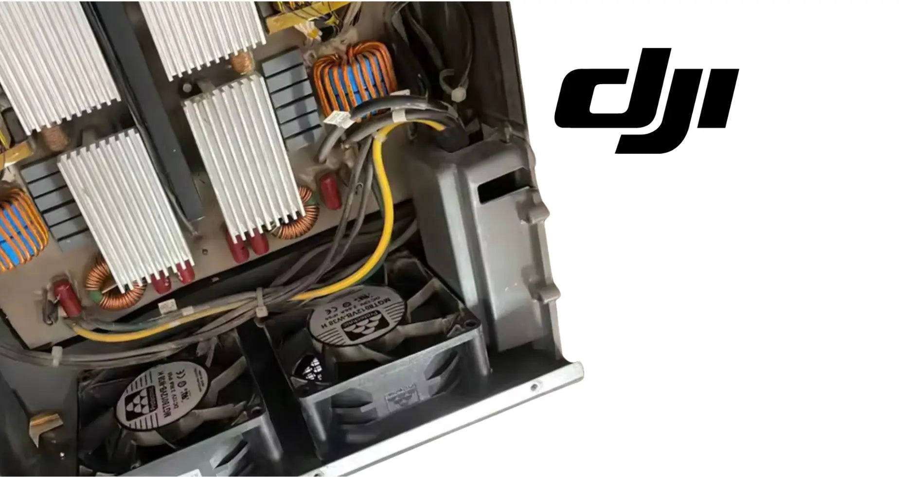 DJI Agras AC-DC power module with cooling fan and control components close-up