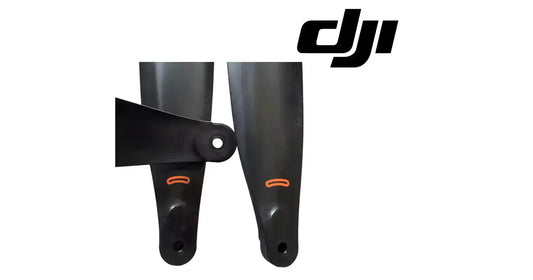 DJI carbon fiber propellers, black blades with orange tip markings, close-up on hubs